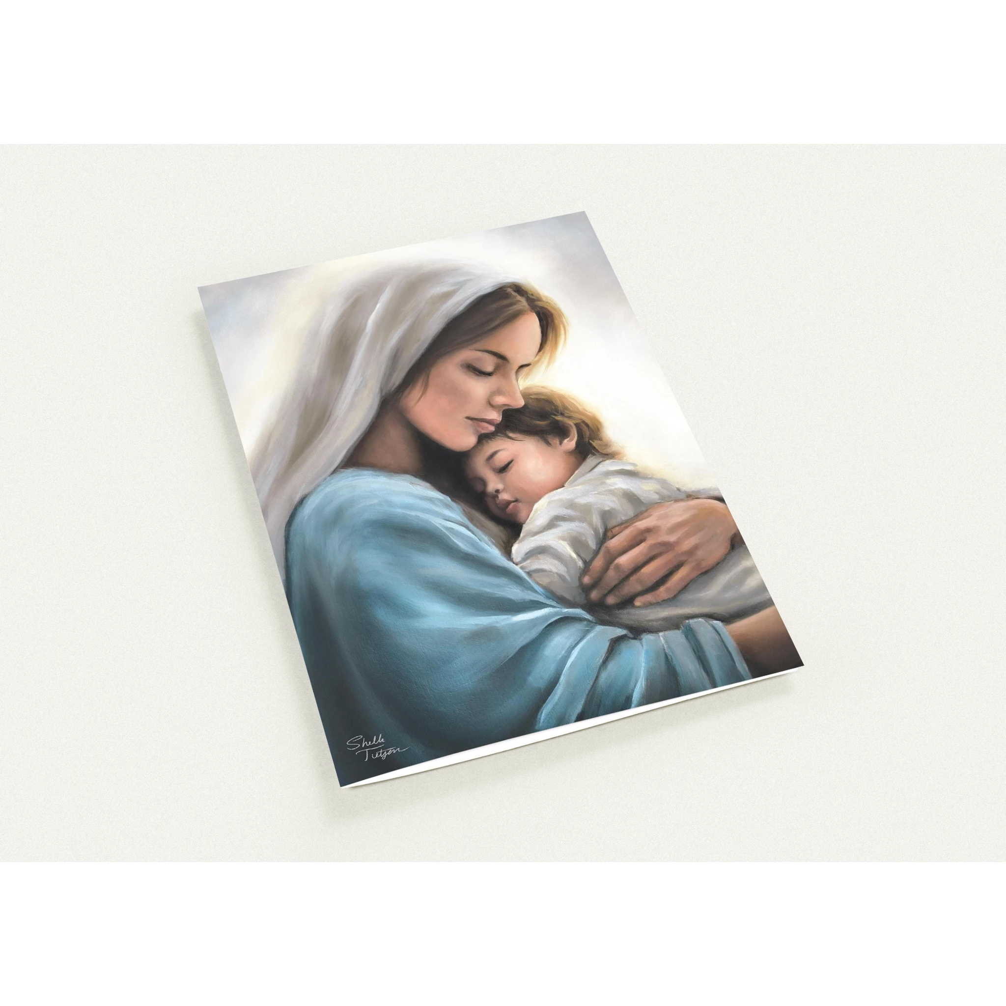 Print of Mary holding Jesus child on a white background