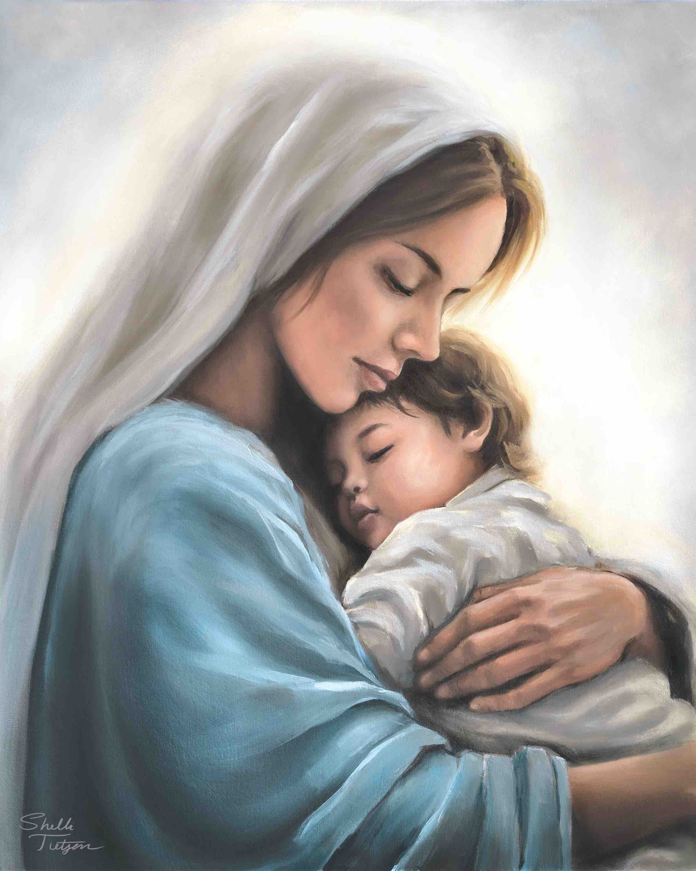 Painting of mother Mary holding Jesus child with a soft, warm light background