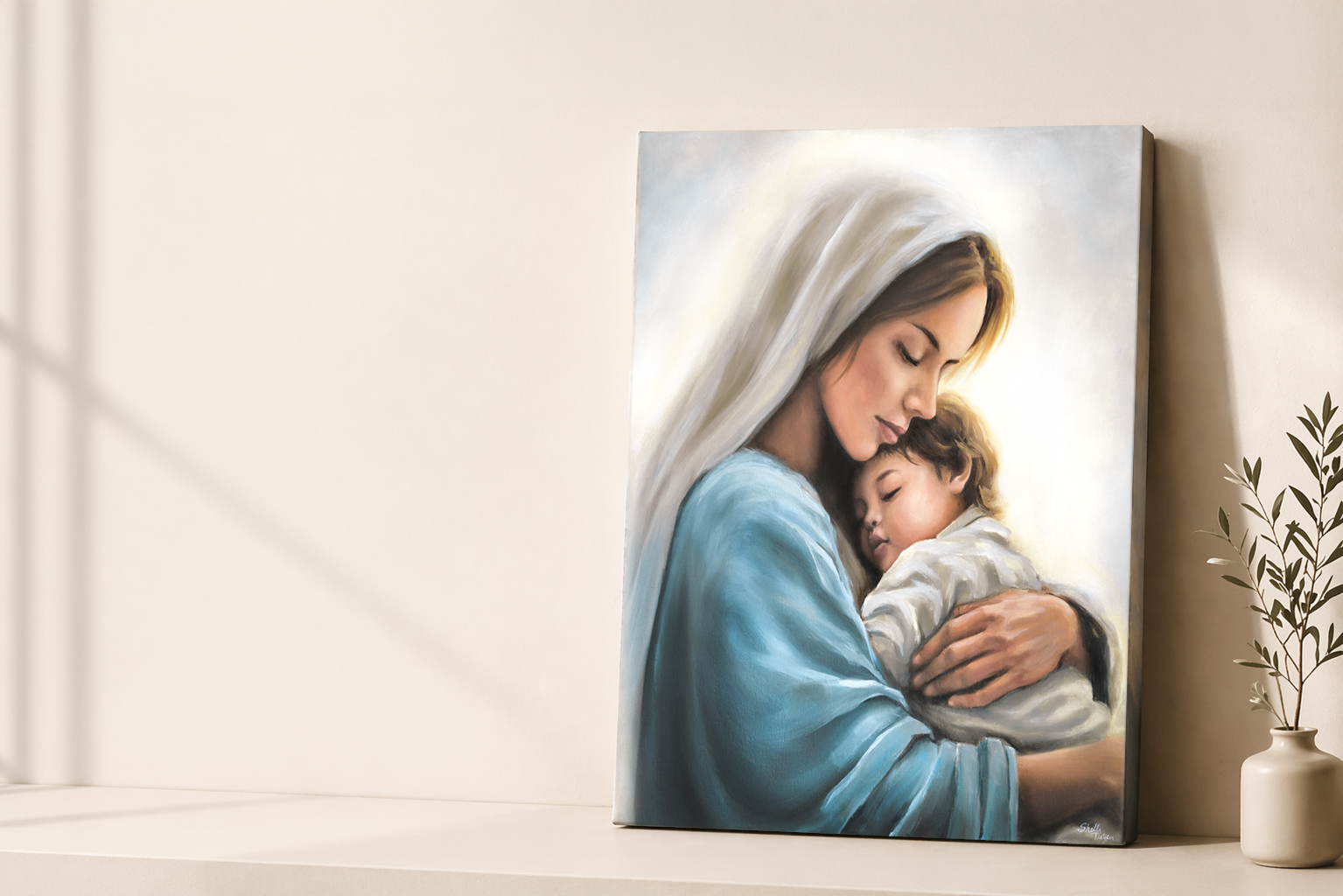 Canvas print of a mother mary holding little child Jesus against a light wall.