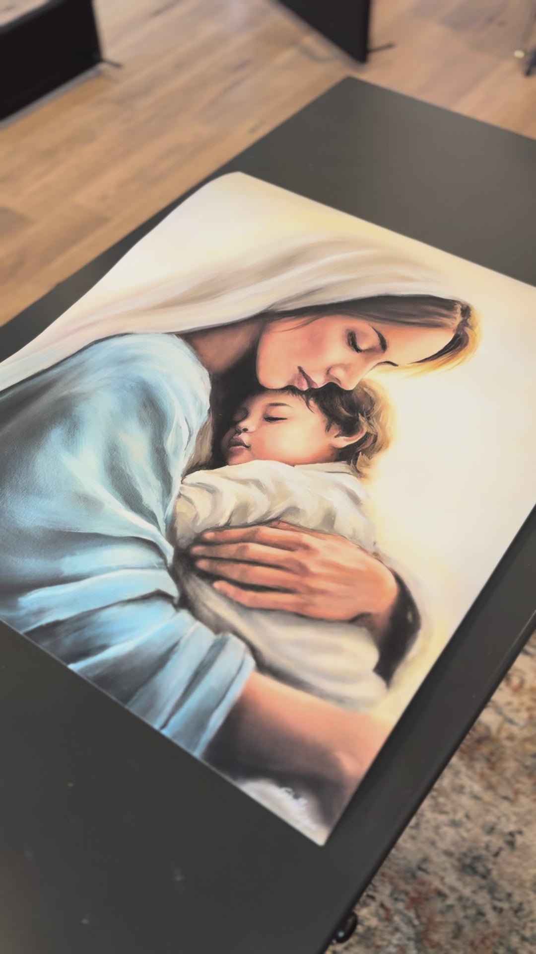 A close up video of the print Held in Grace. Mary holding little Christ.